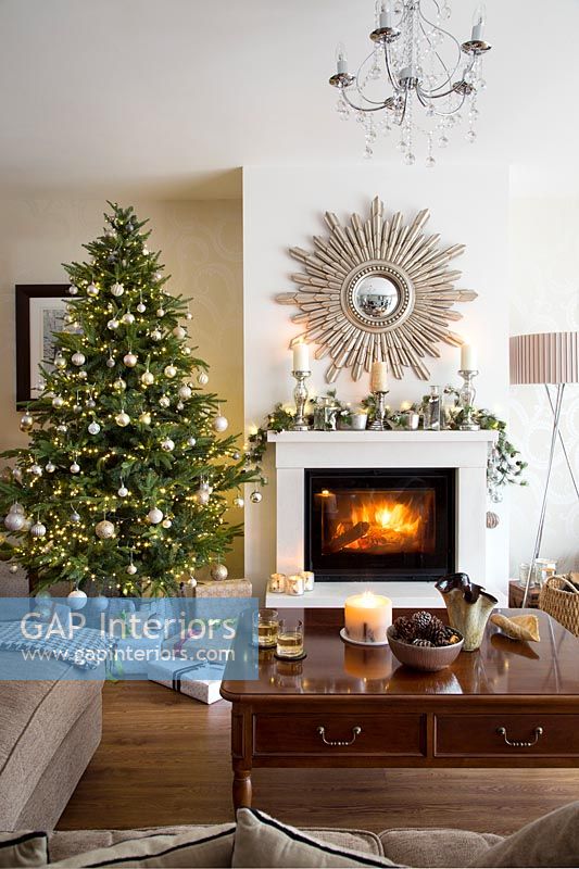 Christmas tree beside fireplace