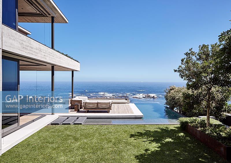 Contemporary house with deck overlooking sea