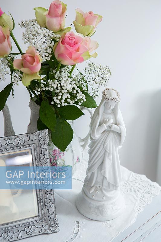 Religious ornament with vase of Roses and Gypsophila