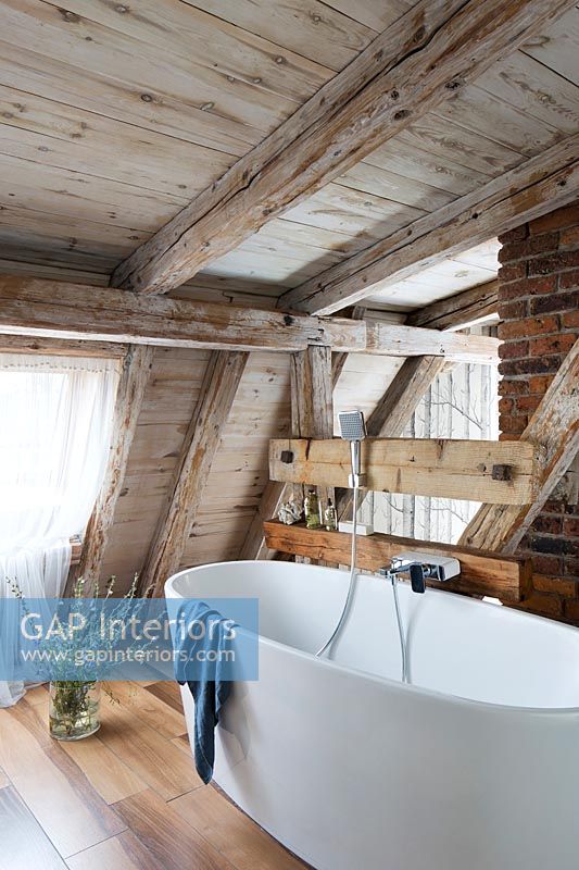 Bathroom with wooden exposed beams