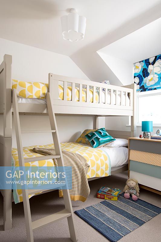 Wooden bunk beds in childrens bedroom