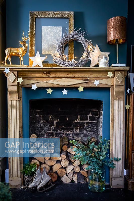 Wooden mantelpiece decorated for Christmas 