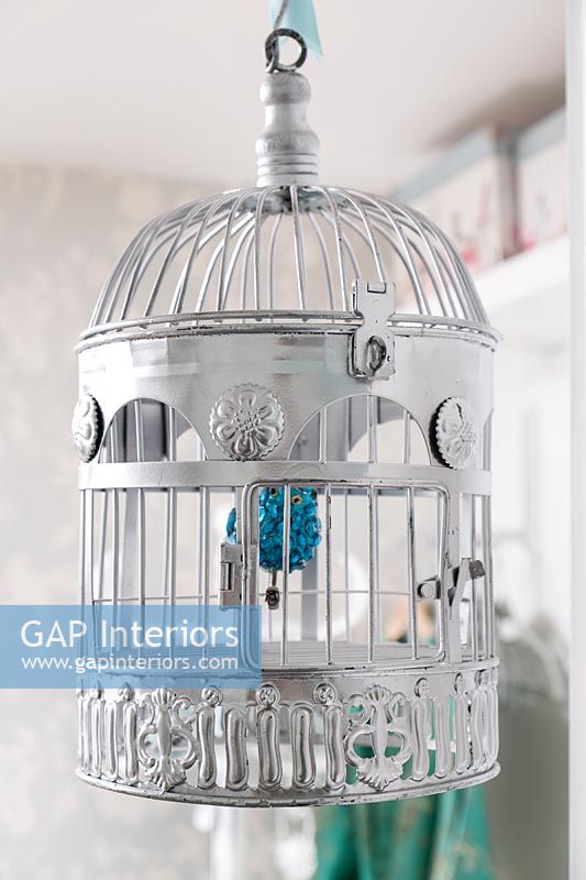 Silver painted bird cage as decoration 