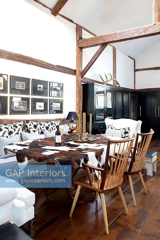 Cottage style dining room with exposed wooden beams 