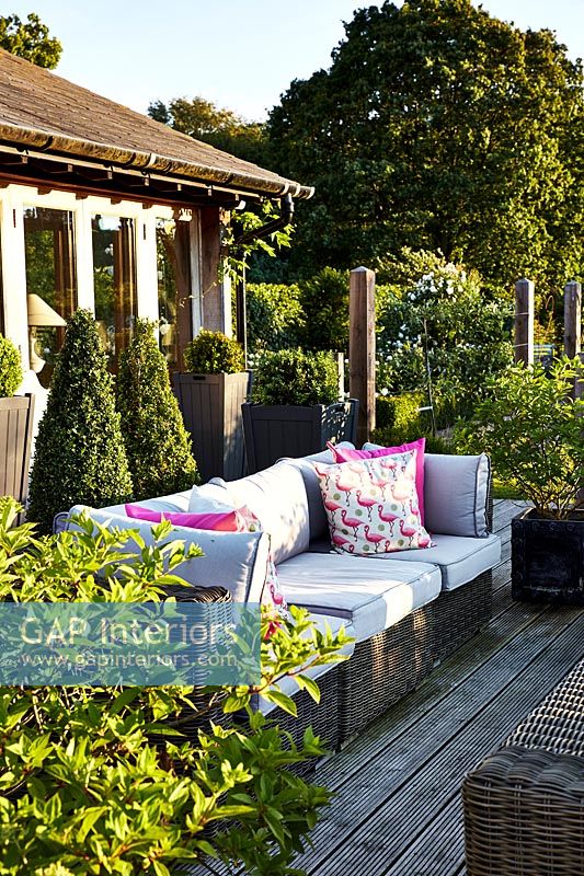 Wooden terrace with garden furniture 