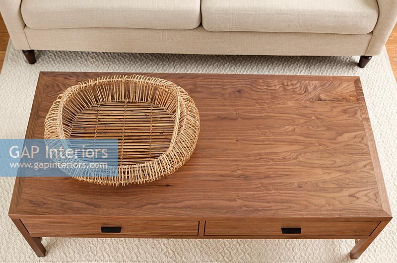 Basket on wooden coffee table 