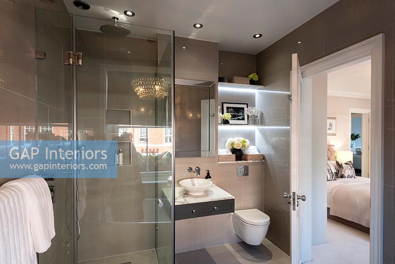 Modern ensuite bathroom with view to bedroom 