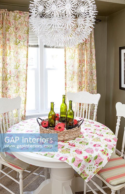 Country dining room with colourful tablecloth 