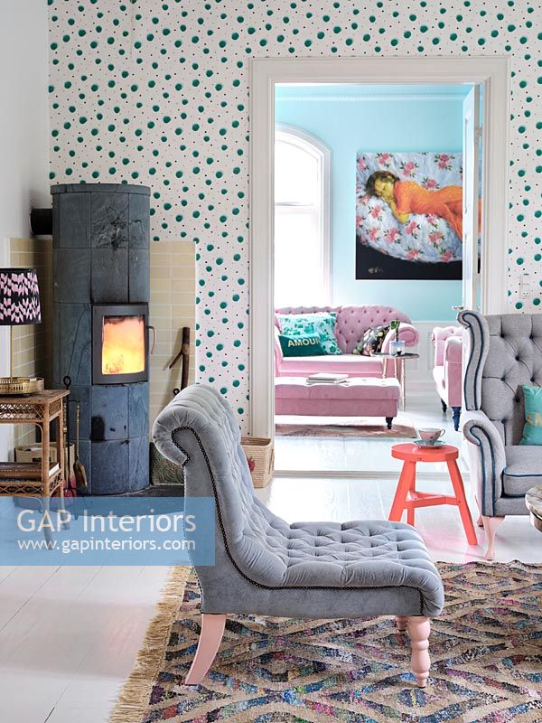 Spotty feature wall with log burning stove in modern living room 
