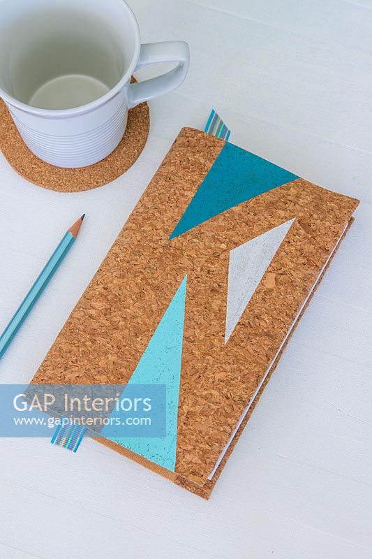Cork covered notebook with geometric painted shapes