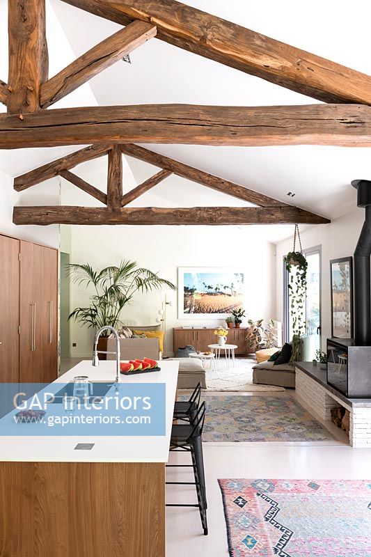 Exposed wooden beams in open plan living space