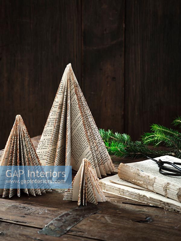 Christmas decorations made from folded book pages