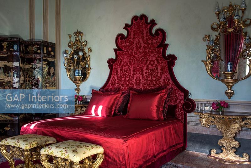 Red bed in luxurious classic bedroom 