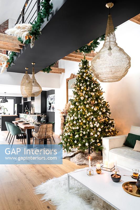 Modern open plan living space decorated for Christmas 