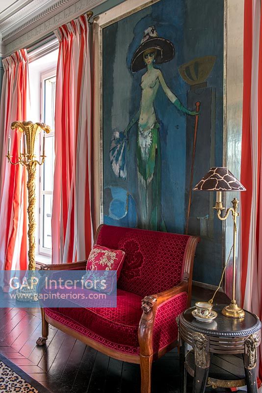 Colourful classic sitting room with large painting of nude 