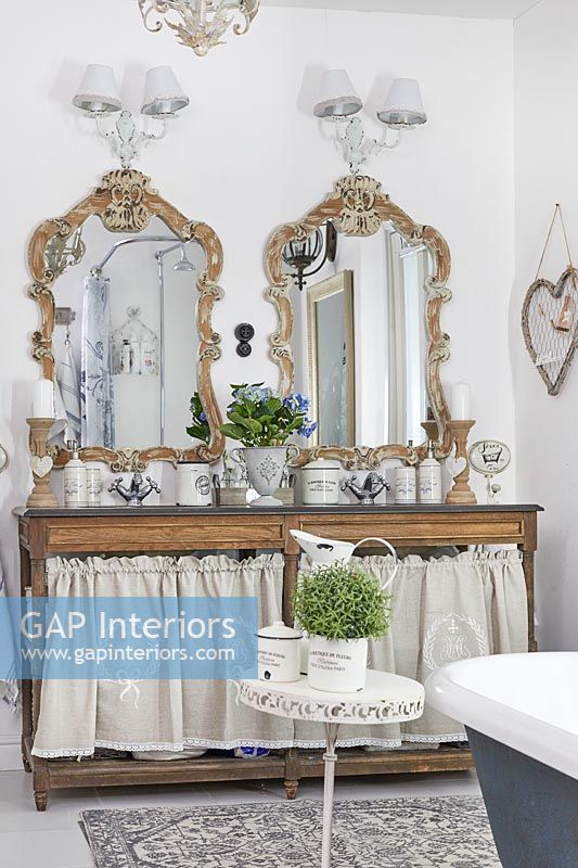 Double sink unit and ornate mirrors 
