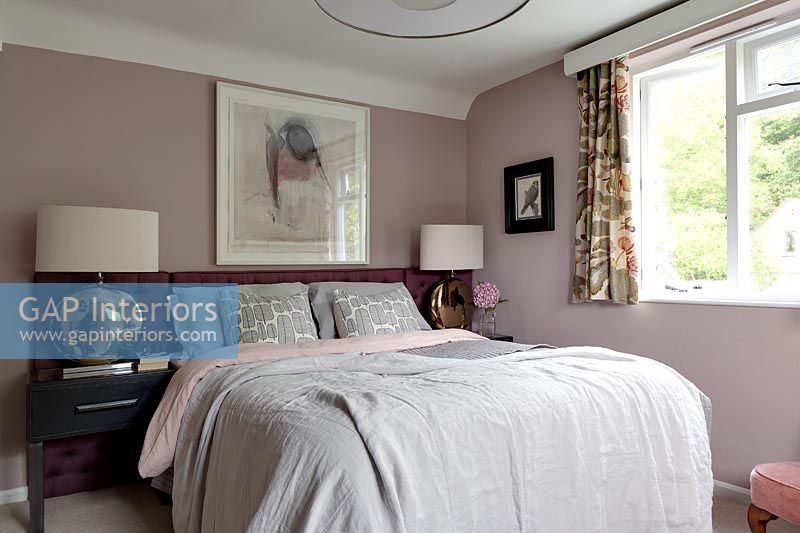 Dusky pink painted walls in country bedroom 