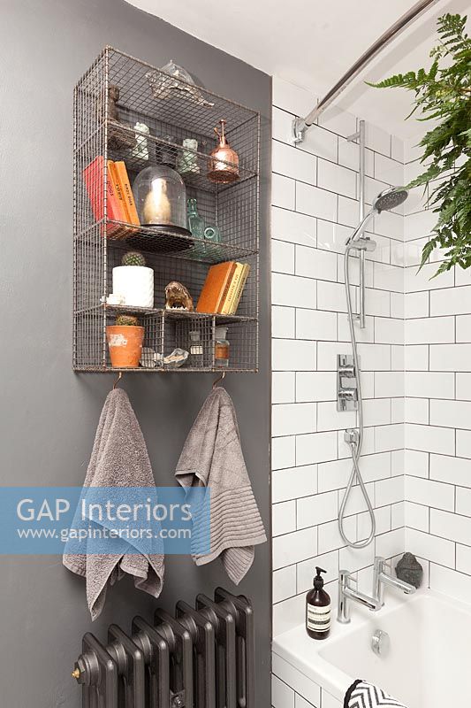 Wire wall mounted shelving in modern bathroom 