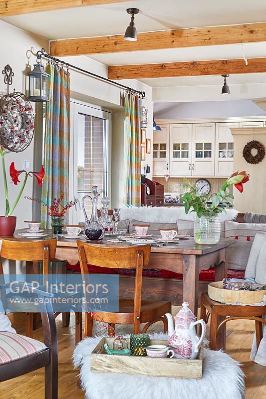 Open plan country living space decorated for Christmas 