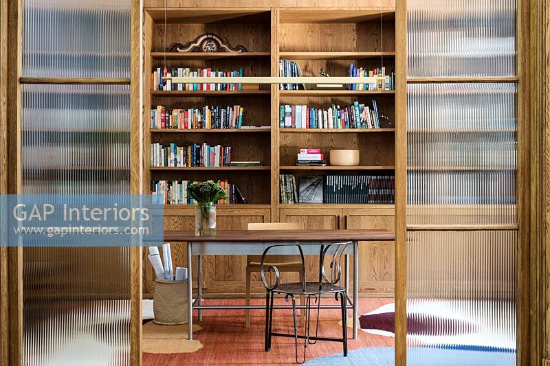 View through glazed sliding doors into reading room 