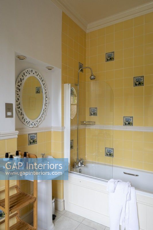 Country house yellow bathroom with tiled walls