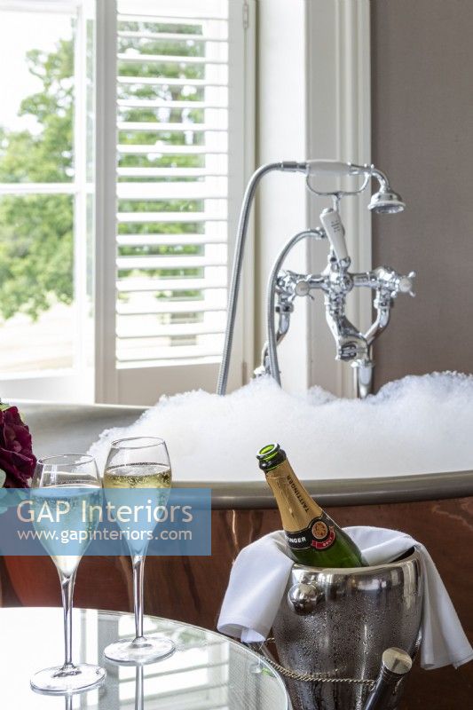 Luxurious bathroom, with bubble bath and champagne served