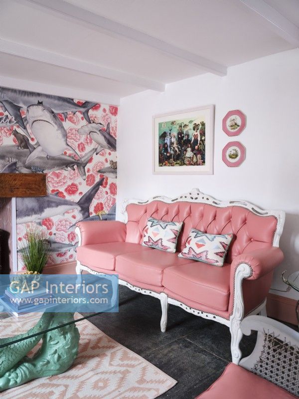 Coastal themed living room with pink furniture 