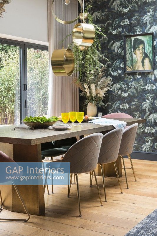Upholstered chairs around modern dining table