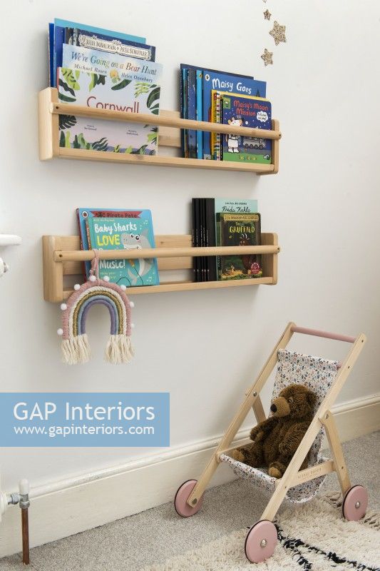 Wall mounted bookshelves in childrens room
