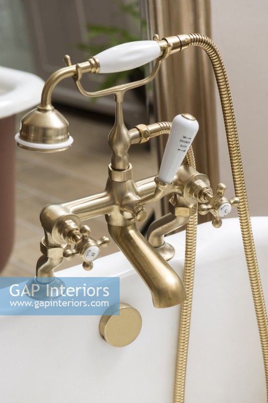 Detail of vintage style mixer taps over bath