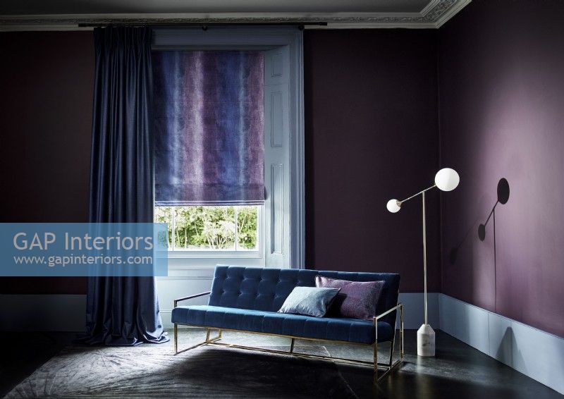 Dark purple room with curtain and roman blind