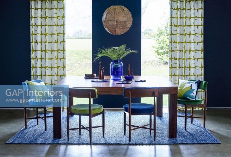 Modern retro dining room with blue walls
