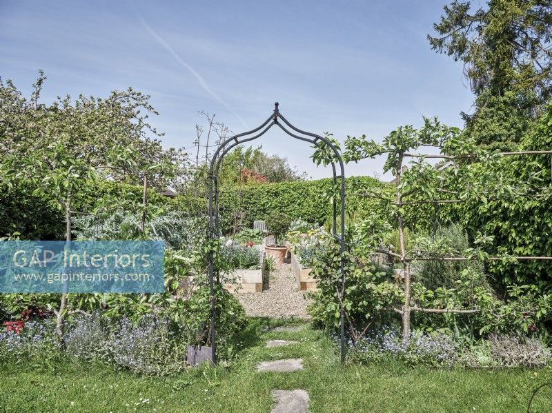 View through arch to kitchen garden