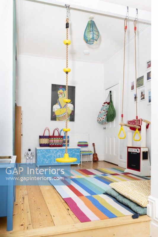 Childrens playroom with hanging swings