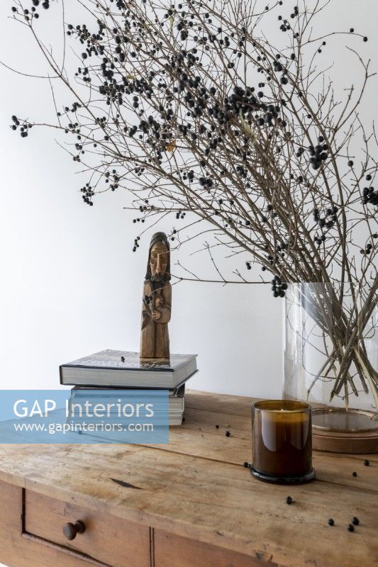 Recycled table decoration with sculpture and books