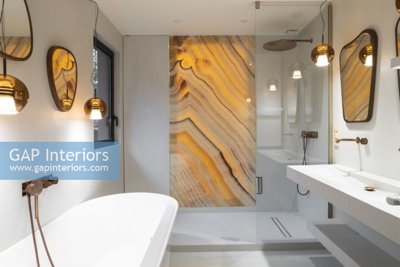 Golden yellow marbled glass panel in contemporary shower cubicle 