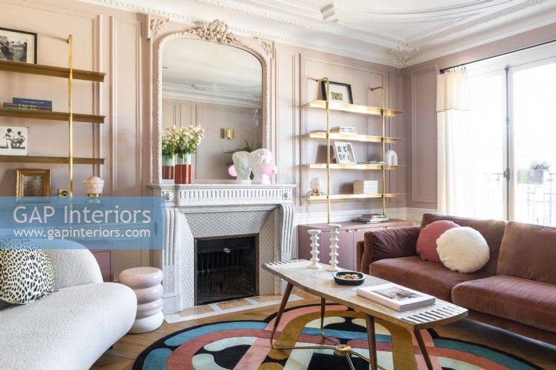 Pink painted walls and furnishings in modern living room