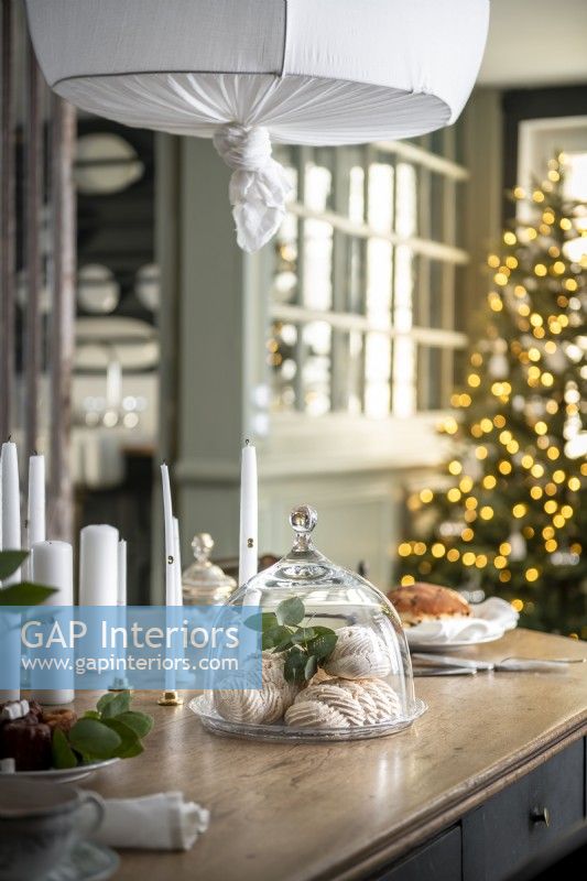 Christmas tree and cakes in modern country dining room