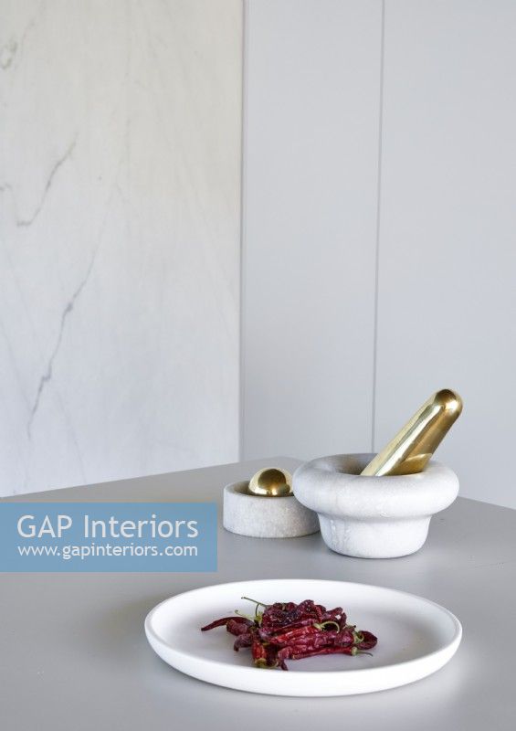 White and gold accessories on kitchen worktop