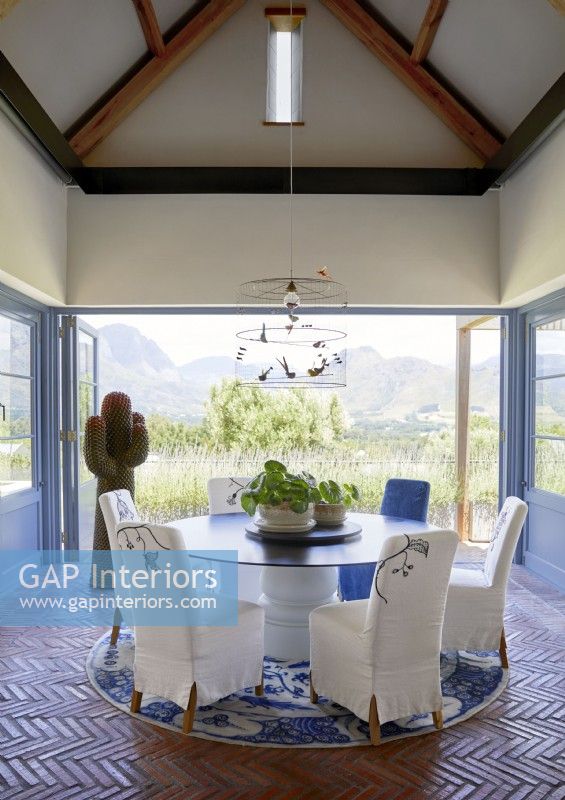 View of mountains and countryside from blue and white dining room