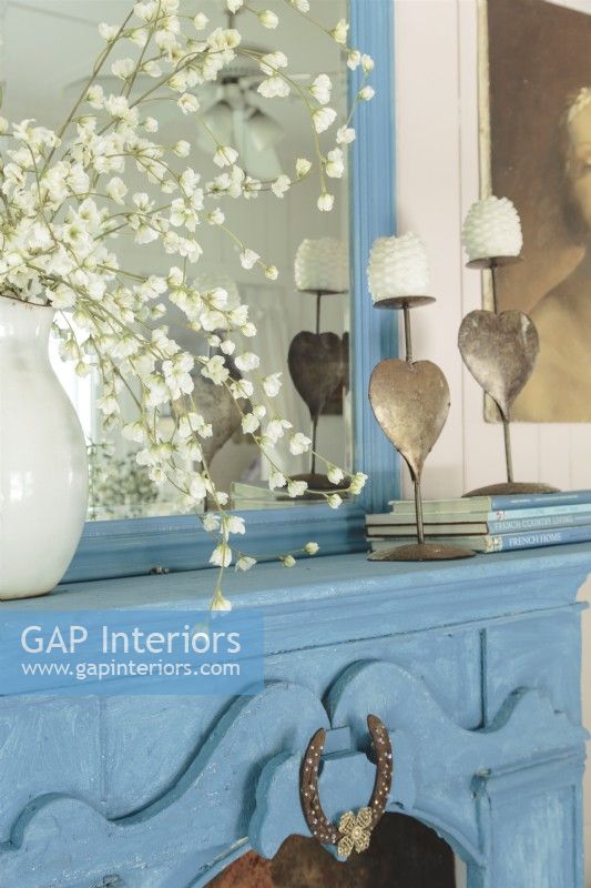 A simple vignette of favorite items celebrates French country style.