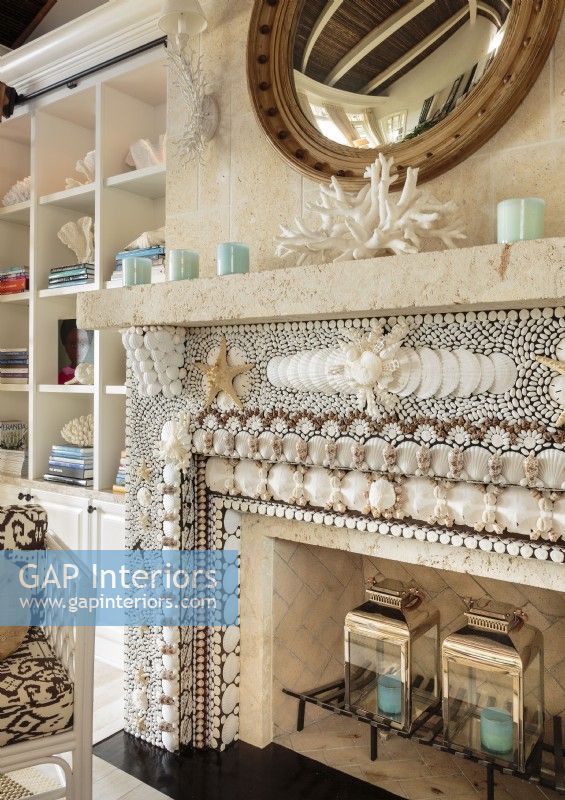 With a myriad of shells arranged in a mosaic-like designed the fireplaces the focal point of the living room.