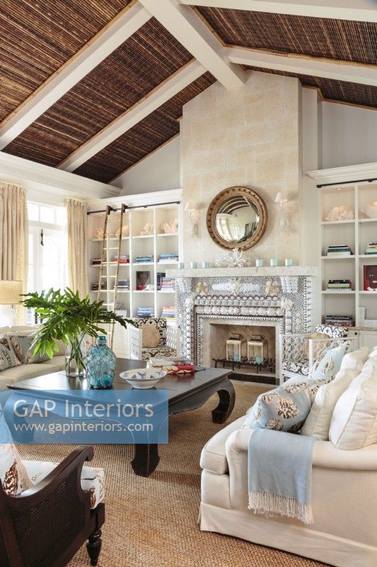 The living room embodies the seaside elegance of West Indie style.