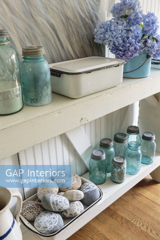 Vintage enamelware and aqua jars are some of Erin's many collections.