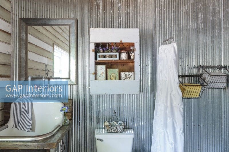 Metal accessories are used for continuity in the bathroom