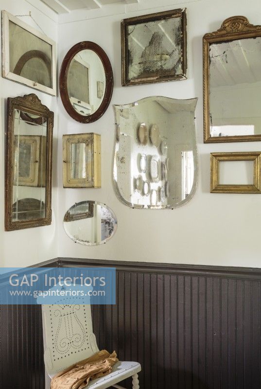 Vintage mirrors add sparkle and brightness in the dining room.