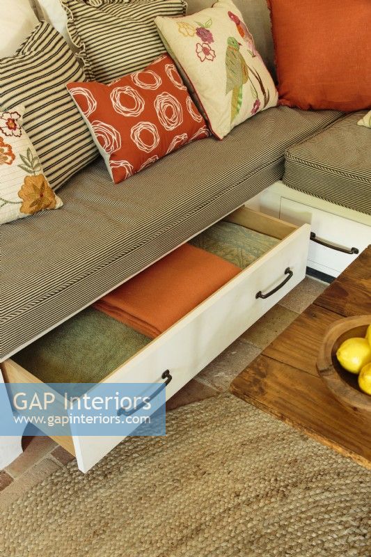 Underneath the sofa, drawers provides storage below for fresh linens and cozy throws.