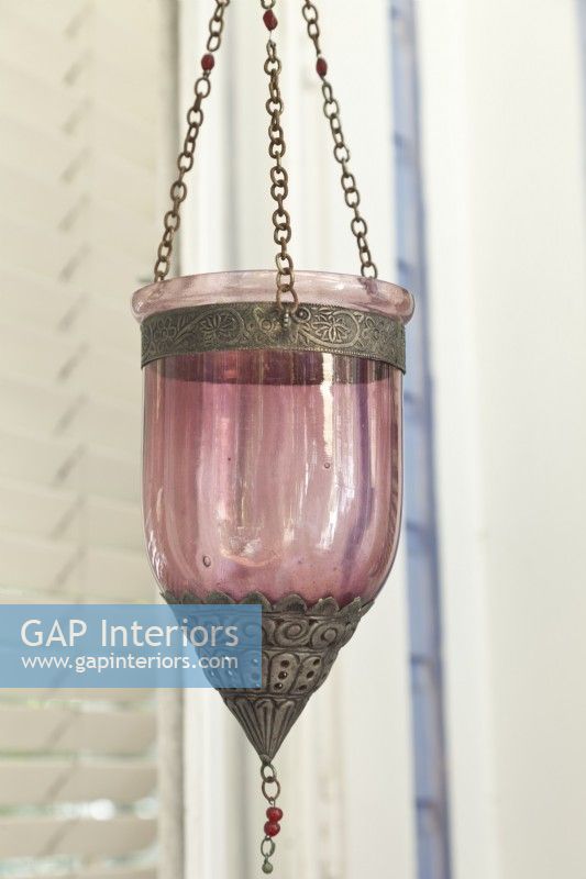  A Moroccan-style lantern fitted with a tealight candle waits for dusk to glow.