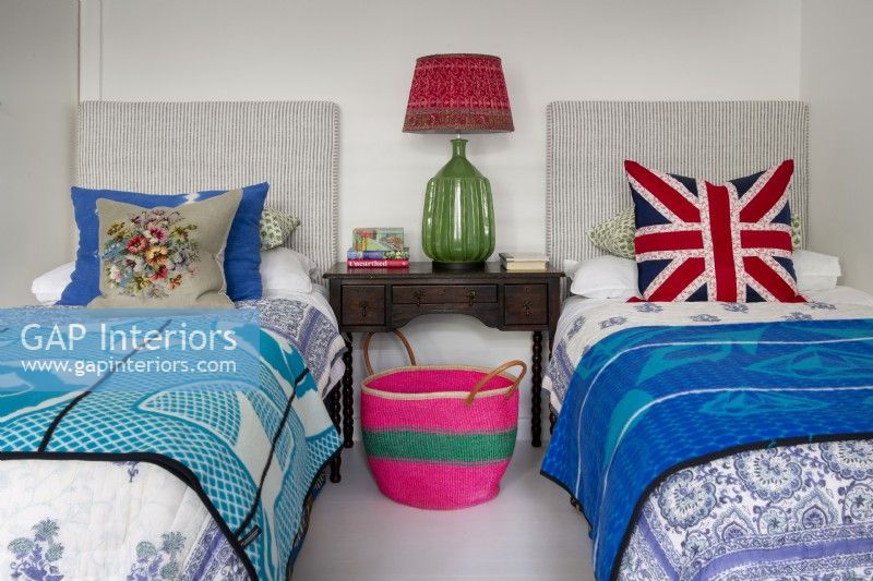 Colourfully dressed twin beds