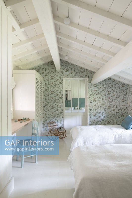 Country bedroom with floral wallpaper feature wall 